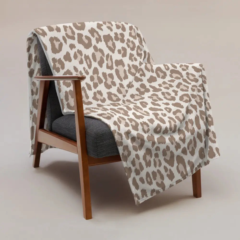 Tan leopard print blanket soft beige and taupe leopard print throw blanket draped over wooden armchair
