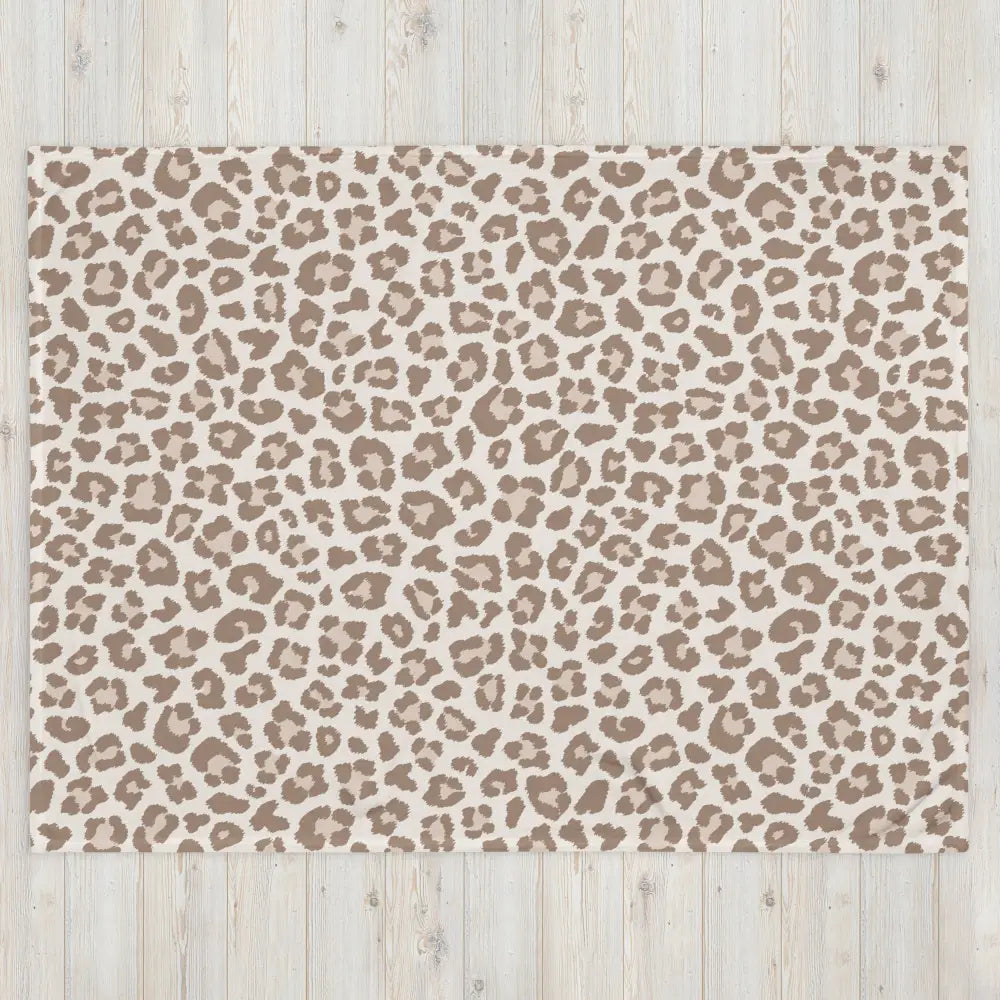 Tan leopard print blanket featuring a beige and taupe leopard-print rectangular rug design for cozy use