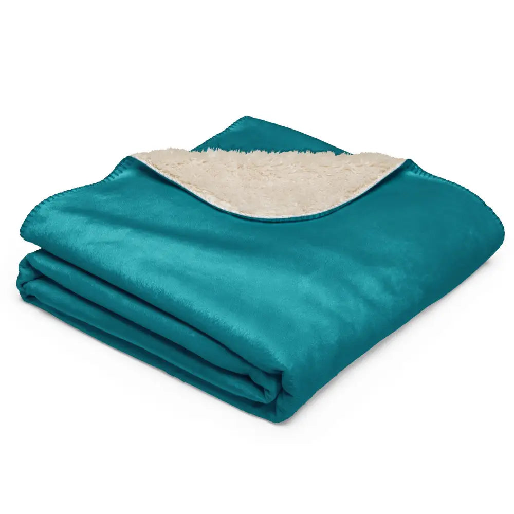 Teal sherpa throw blanket with soft cream-colored sherpa lining perfect for cozy warmth and comfort