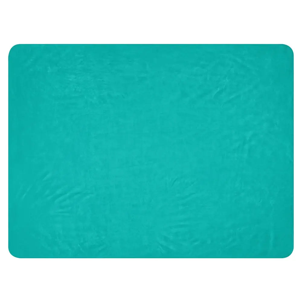 A teal-colored textured rectangular mat with a slightly crinkled surface for the turquoise sherpa blanket