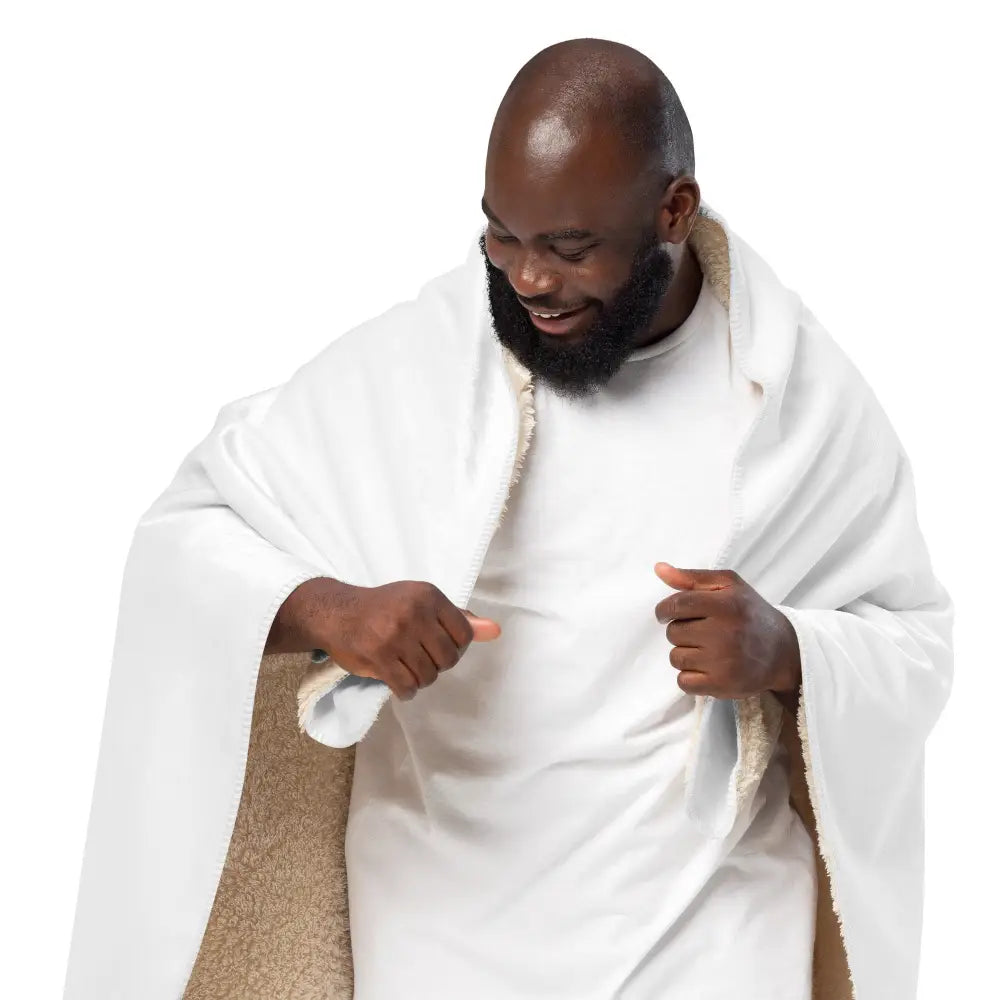 White sherpa blanket with soft white fleece exterior and plush interior lining for cozy warmth and comfort