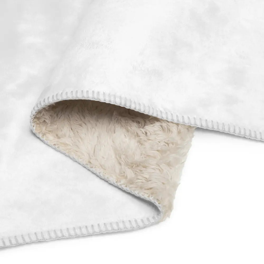 White sherpa blanket with soft plush inner lining made of white fleece for cozy warmth and comfort