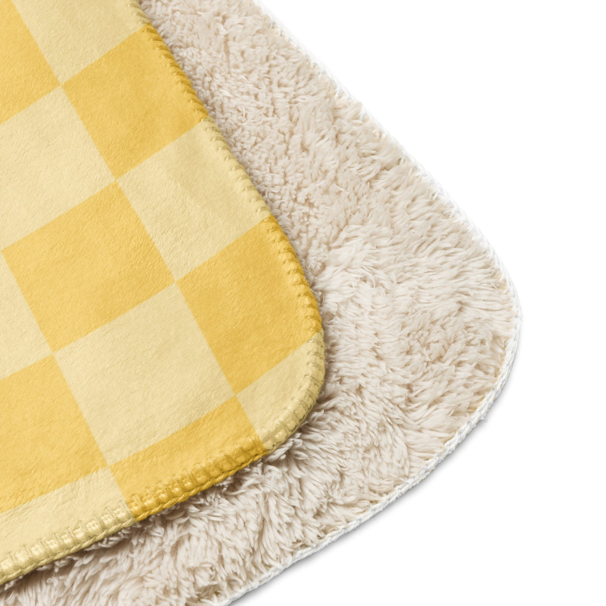 Yellow checkered blanket with cream accents and a plush fuzzy underside for cozy warmth and comfort