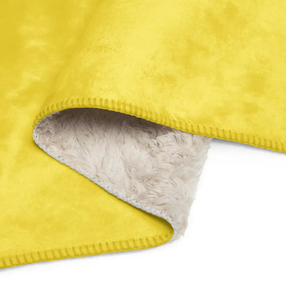 Yellow sherpa throw blanket with bright yellow faux suede and plush white sherpa lining for cozy warmth